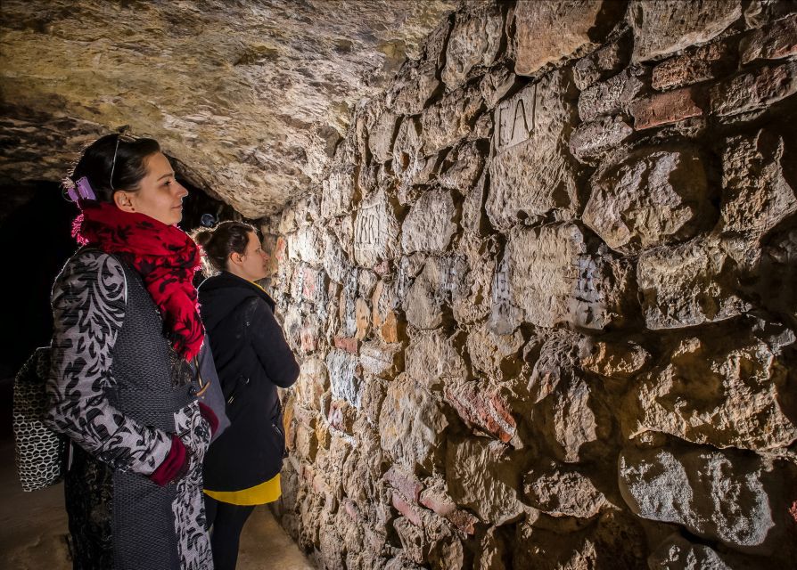 Budapest: Buda Castle Cave Tour - Wine cellars, bomb shelters, and a medieval prison role