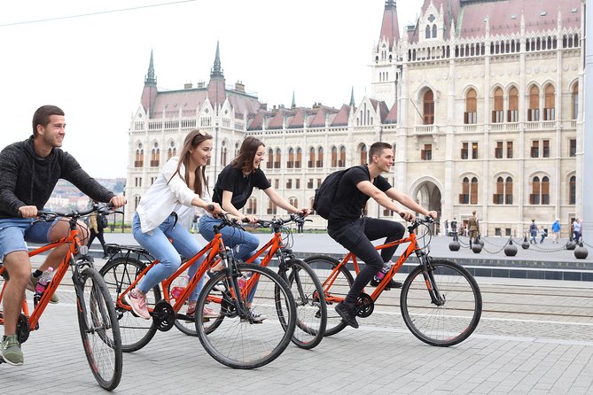 Budapest Historic Downtown Bicycle Tour in small groups - Danube Bank icons: Parliament, Shoes, baths, and bridges