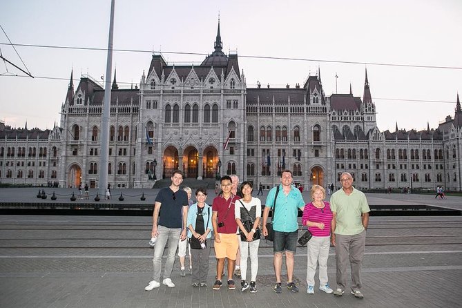 Budapest Night Walking Tour with Danube River Cruise - The 1-hour Legenda Danube cruise: drink, commentary, and photo reality
