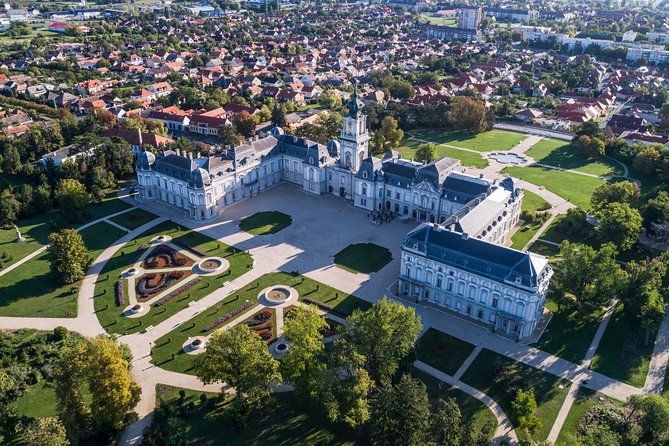 Discover Keszthely: Charming Private Walking Tour - Entering Festetics Palace, then understanding why it is so huge