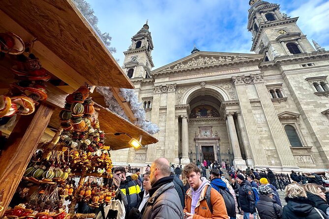 Private Budapest Christmas Market Tour with Chimney Cake & Mulled Wine - Between stops: landmarks like Gresham Palace, seen at street level